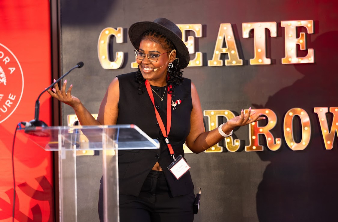 Tumi Setshedi speaking on stage
